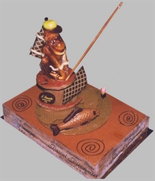 Torta compleanno con decoro discimmia che pesca in cioccolato
